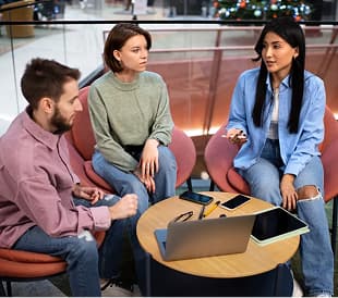 Team members collaborating in a lounge area